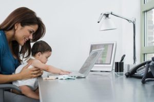 Mother and baby using a laptop computer
